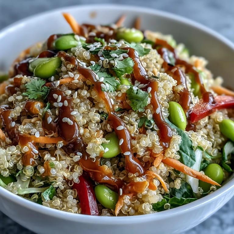Thai Coconut Quinoa Bowl with colorful carrots and purple cabbage, ready to serve as a gluten-free lunch.